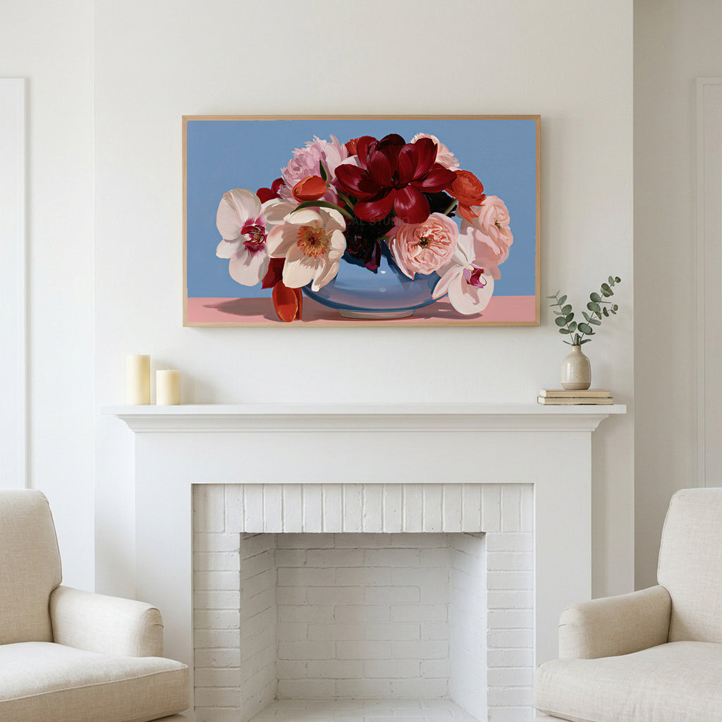 Peony and orchid bouquet art above a white fireplace with candles and eucalyptus on the mantel