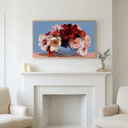 Peony and orchid bouquet art above a white fireplace with candles and eucalyptus on the mantel