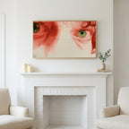 Frame TV art above a white fireplace with candles and eucalyptus on the mantel