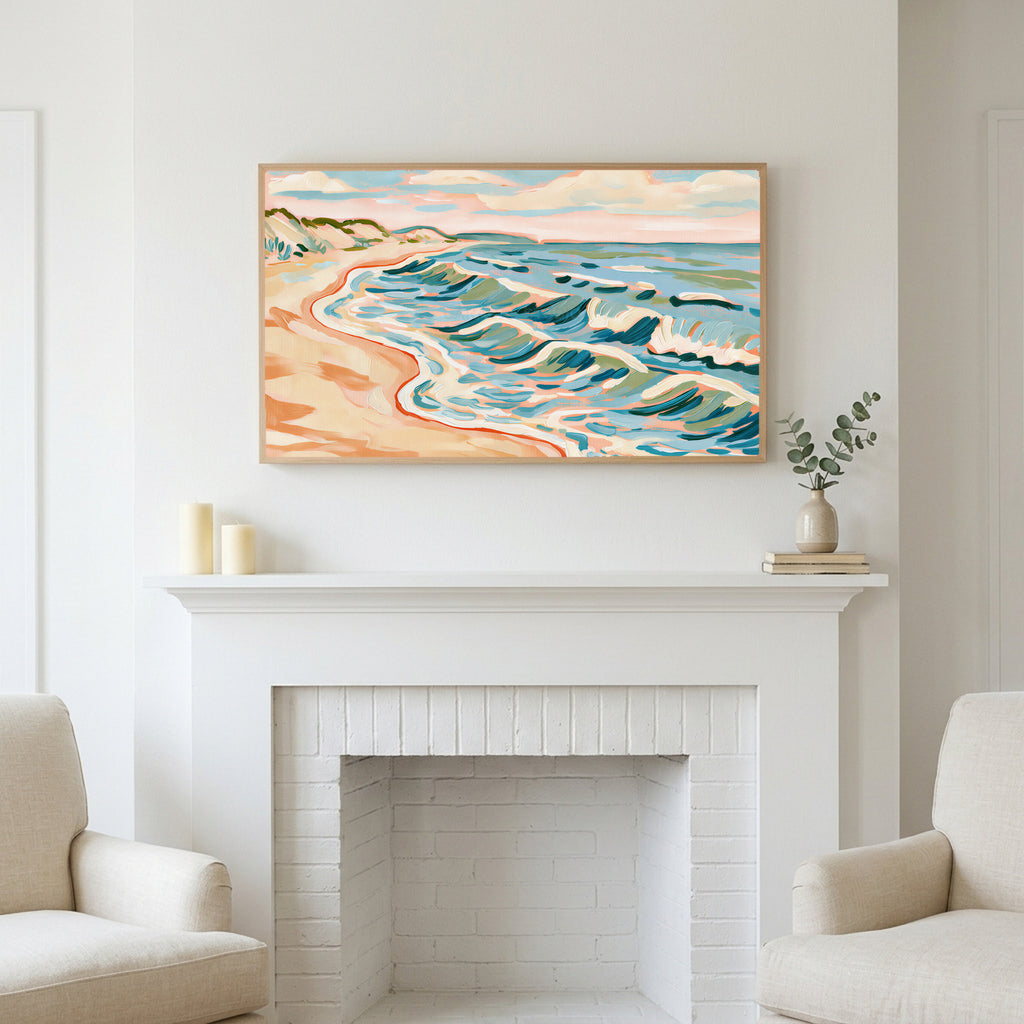 Beach waves art above a white fireplace with candles and eucalyptus on the mantel