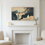 Moody abstract cliffs art above a white fireplace with candles and eucalyptus on the mantel