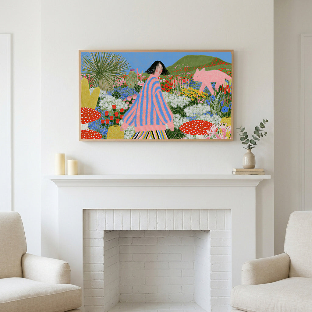 Flower garden and pink fox art above a white fireplace with candles and eucalyptus on the mantel