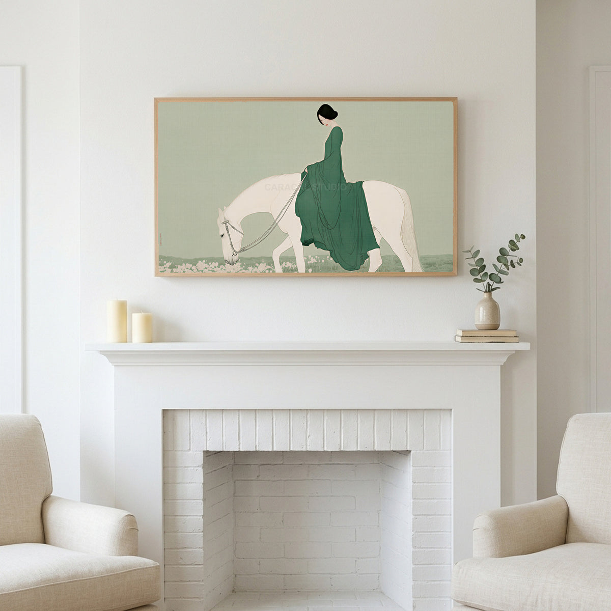 Frame TV art above a white fireplace with candles and eucalyptus on the mantel