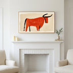 Minimalist bull art above a white fireplace with candles and eucalyptus on the mantel