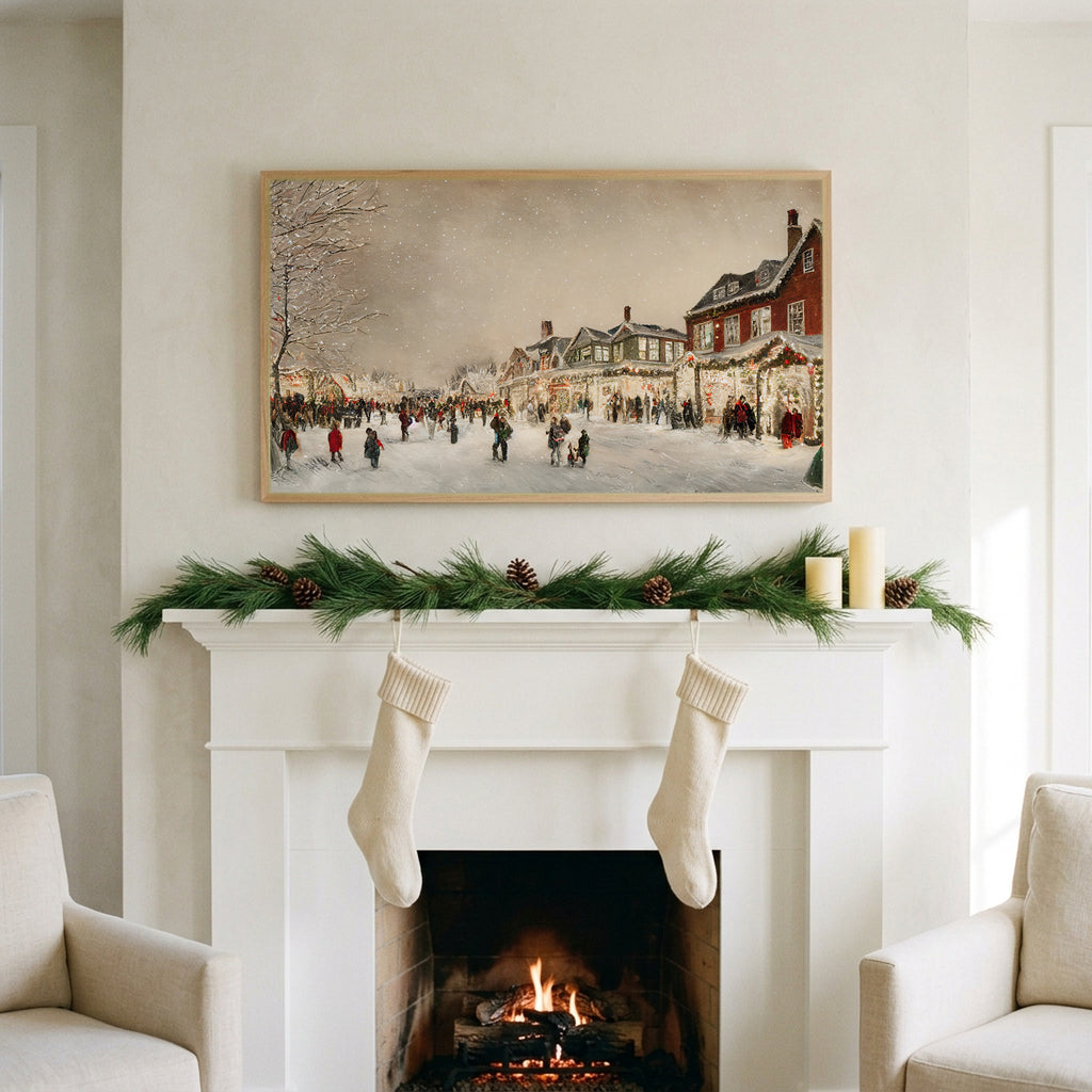 Christmas village street art on a TV above a white fireplace with a pine garland and cream stockings