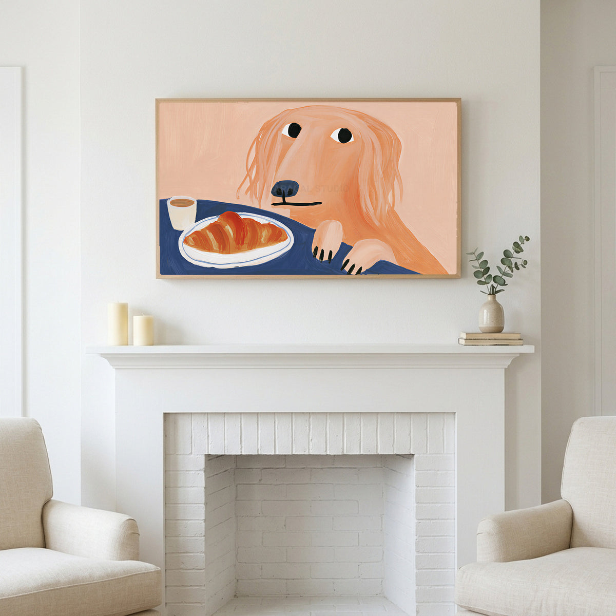 Frame TV art above a white fireplace with candles and eucalyptus on the mantel