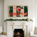 Christmas cocktail typography art on a TV above a white fireplace with a pine garland and cream stockings