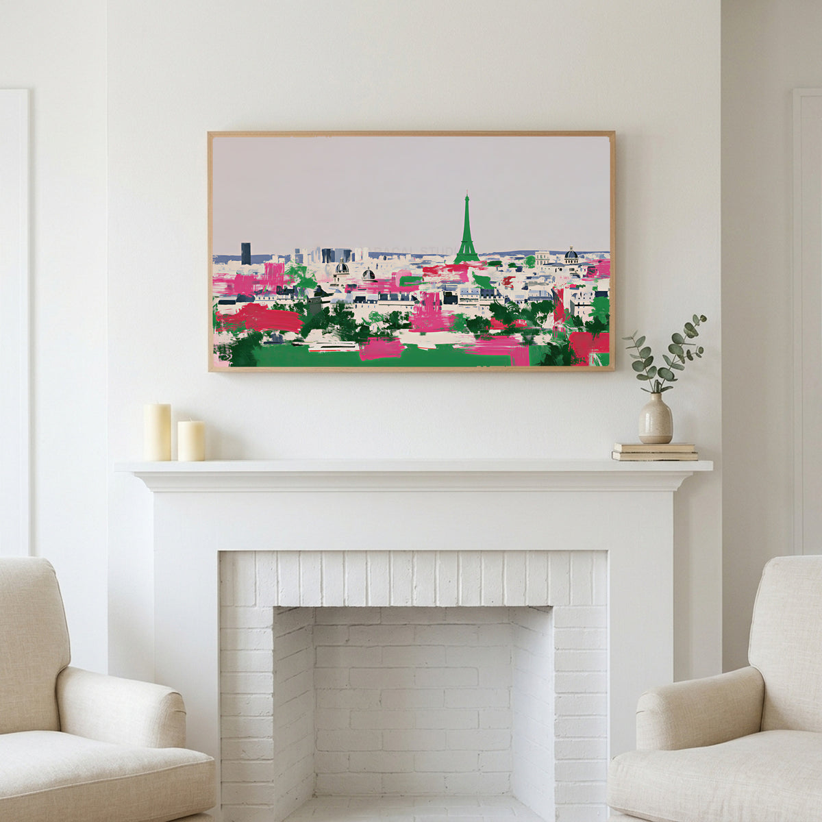 Paris skyline art above a white fireplace with candles and eucalyptus on the mantel