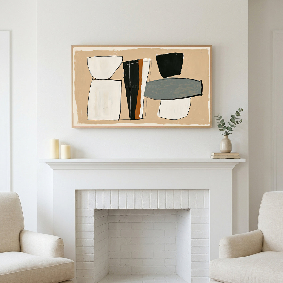 Mid century abstract shapes art above a white fireplace with candles and eucalyptus on the mantel