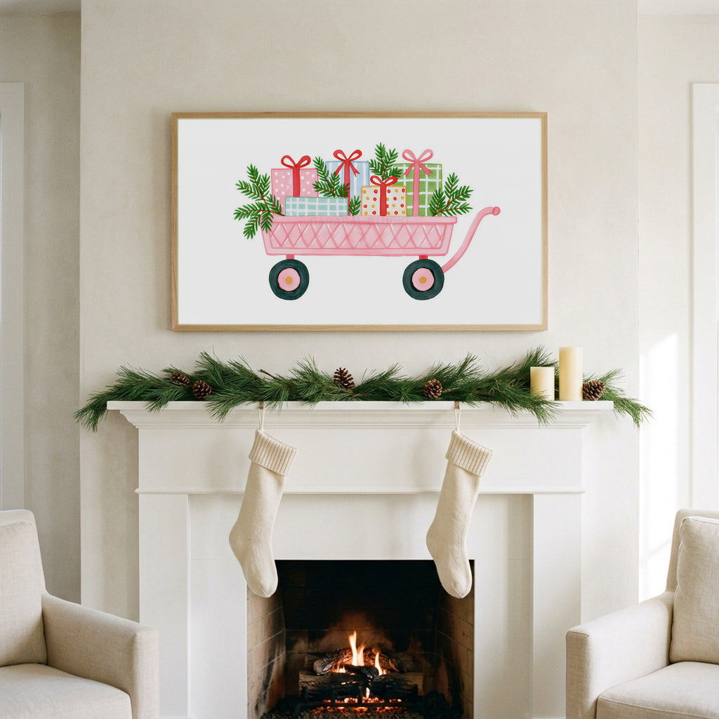 Pink wagon with gifts art on a TV above a white fireplace with a pine garland and cream stockings