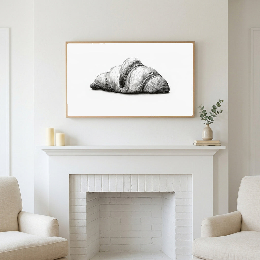 Croissant etching art above a white fireplace with candles and eucalyptus on the mantel