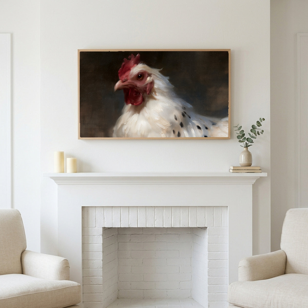 White hen portrait art above a white fireplace with candles and eucalyptus on the mantel