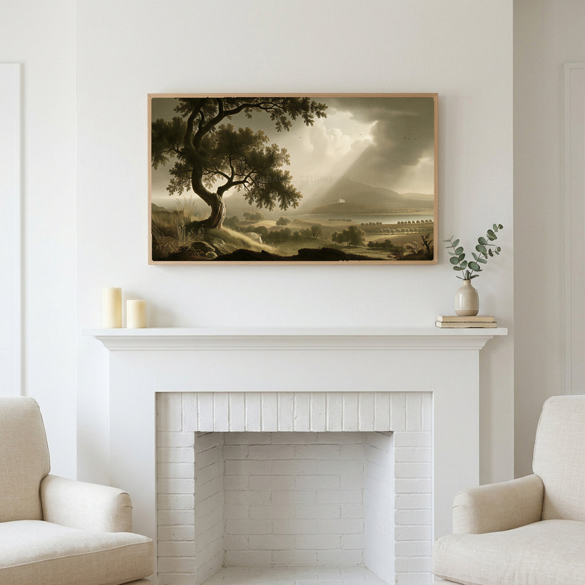 Vintage tree landscape art above a white fireplace with candles and eucalyptus on the mantel