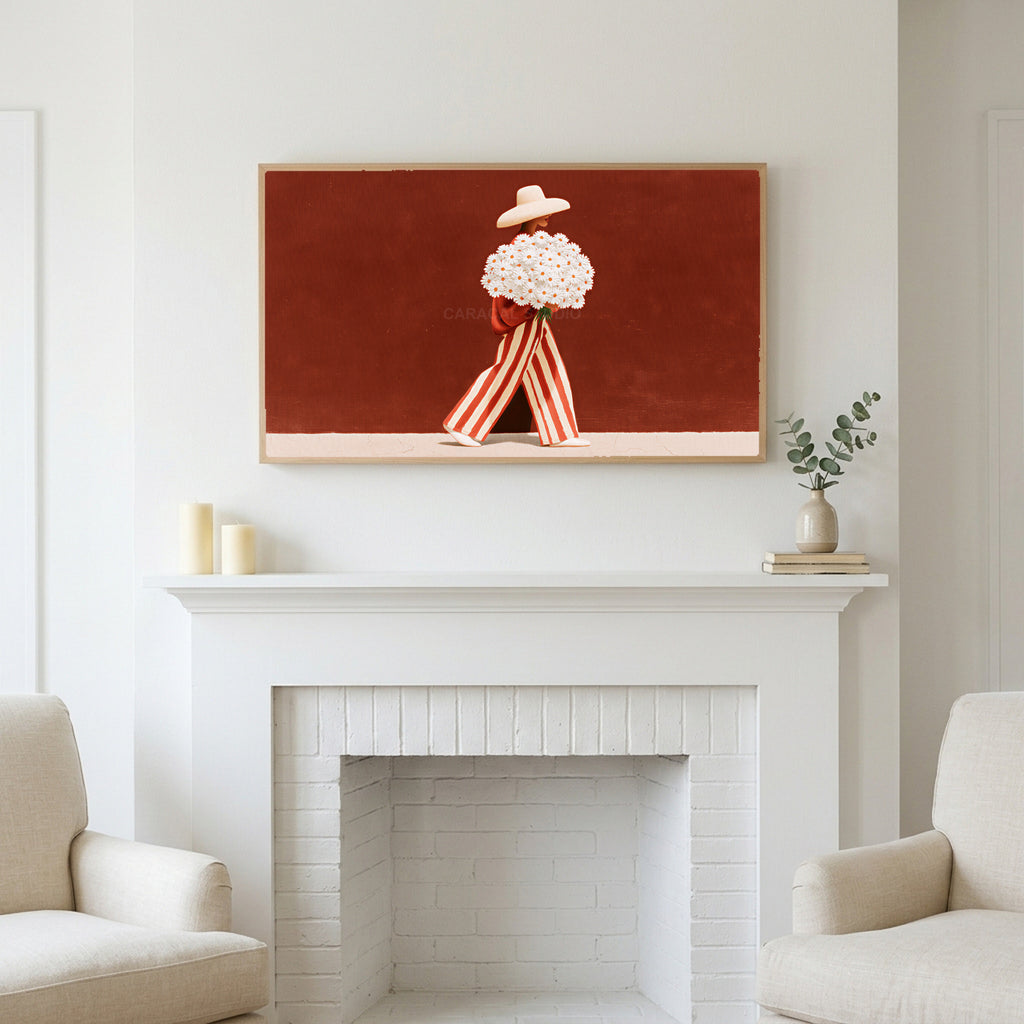 Frame TV art above a white fireplace with candles and eucalyptus on the mantel