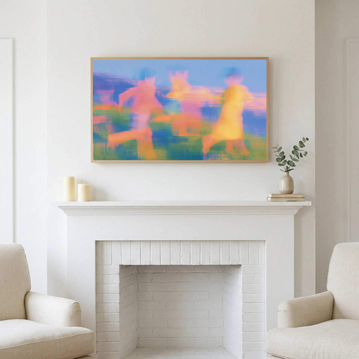 Blurred meadow runners art above a white fireplace with candles and eucalyptus on the mantel