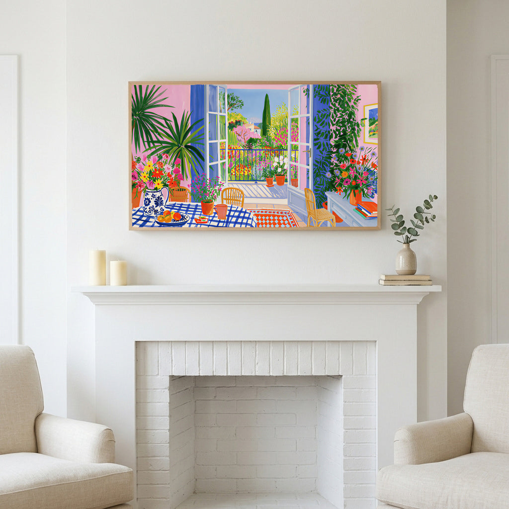 Frame TV art above a white fireplace with candles and eucalyptus on the mantel