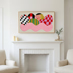 Checkered shapes portrait art above a white fireplace with candles and eucalyptus on the mantel