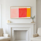 Frame TV art above a white fireplace with candles and eucalyptus on the mantel