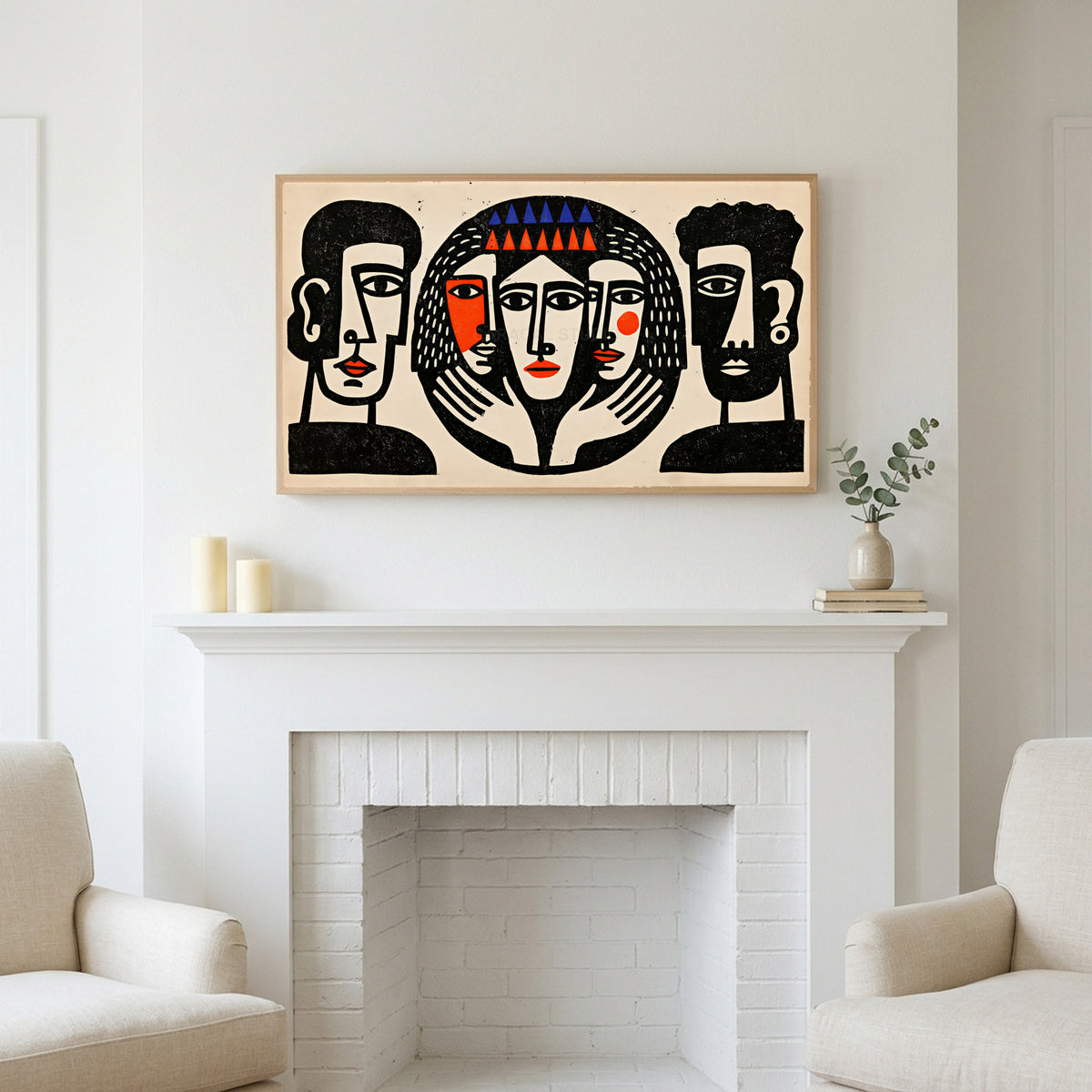 Frame TV art above a white fireplace with candles and eucalyptus on the mantel