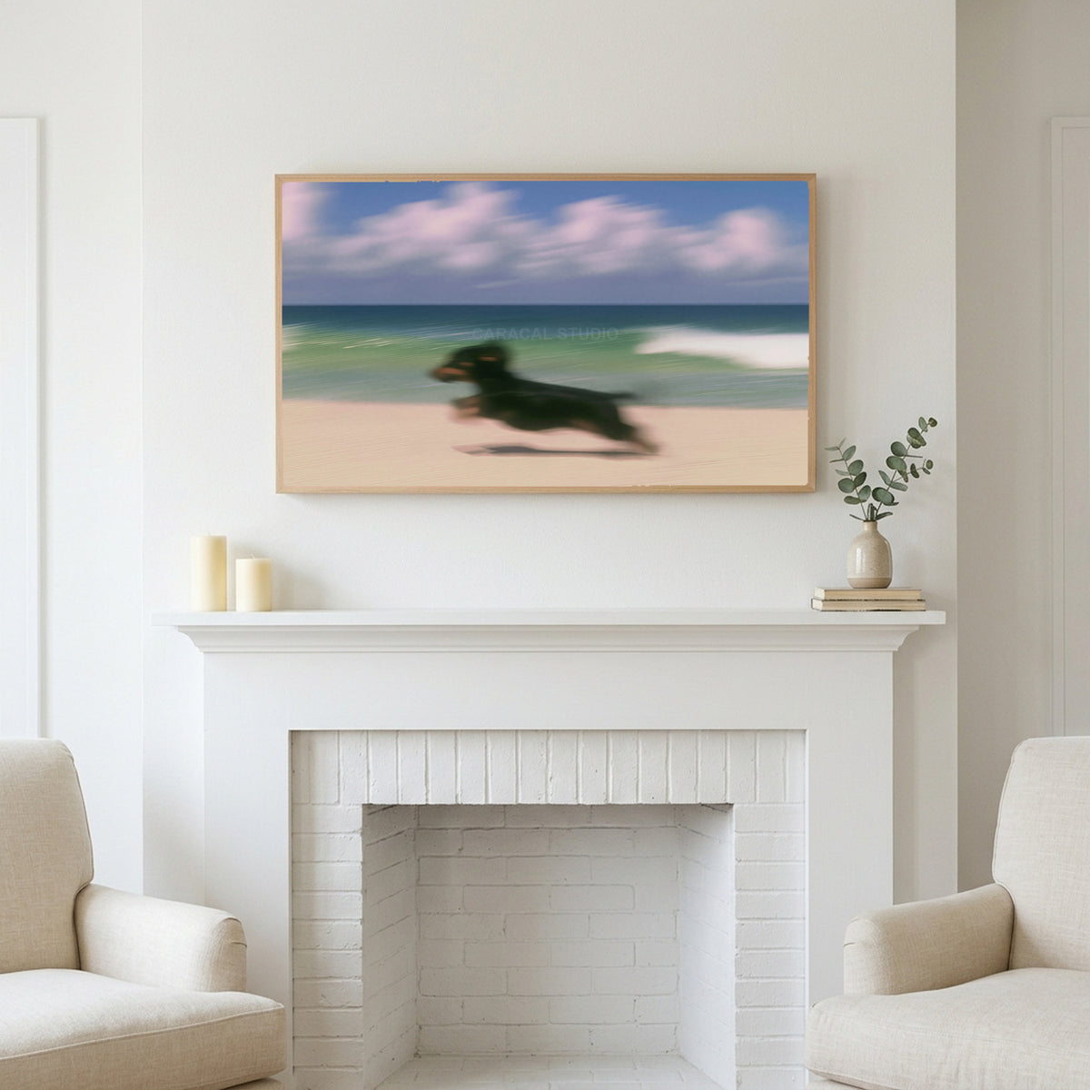 Running beach dachshund art above a white fireplace with candles and eucalyptus on the mantel