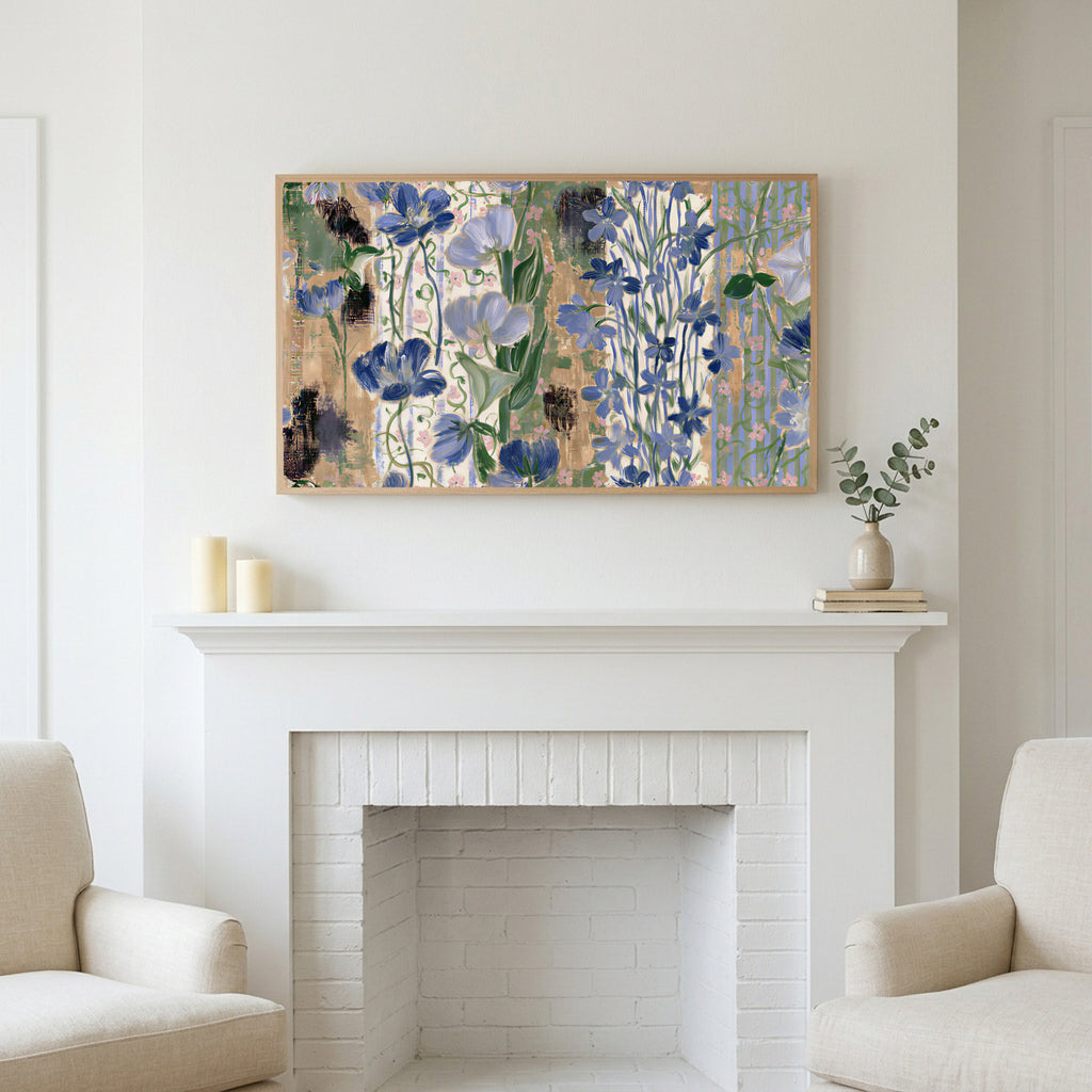 Vintage blue florals art above a white fireplace with candles and eucalyptus on the mantel
