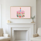 Frame TV art above a white fireplace with candles and eucalyptus on the mantel