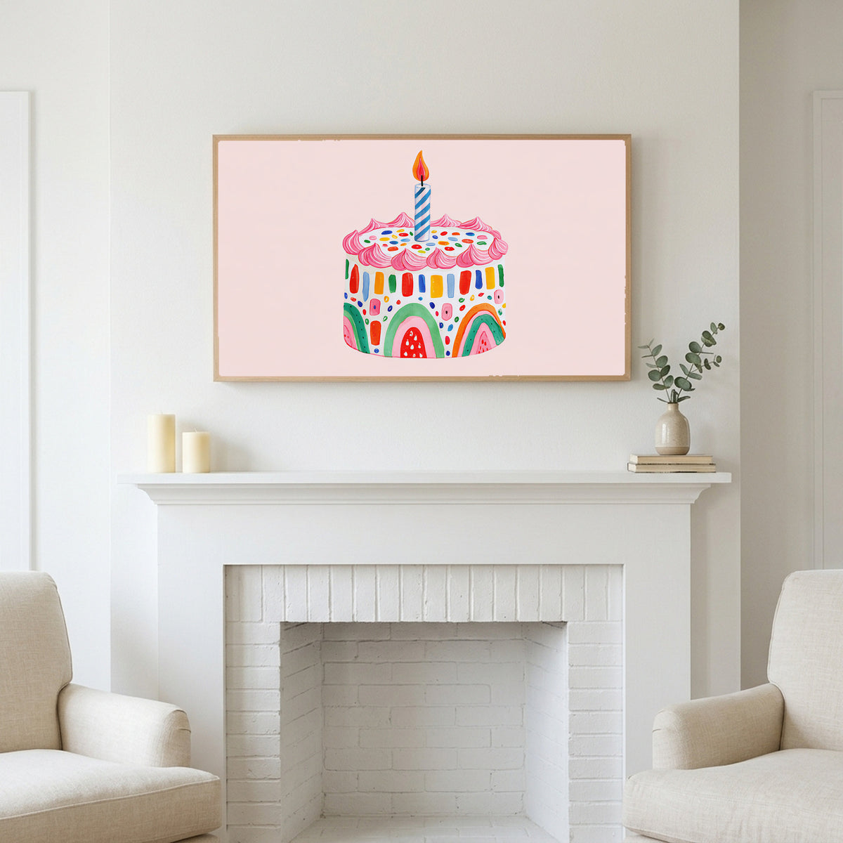 Frame TV art above a white fireplace with candles and eucalyptus on the mantel
