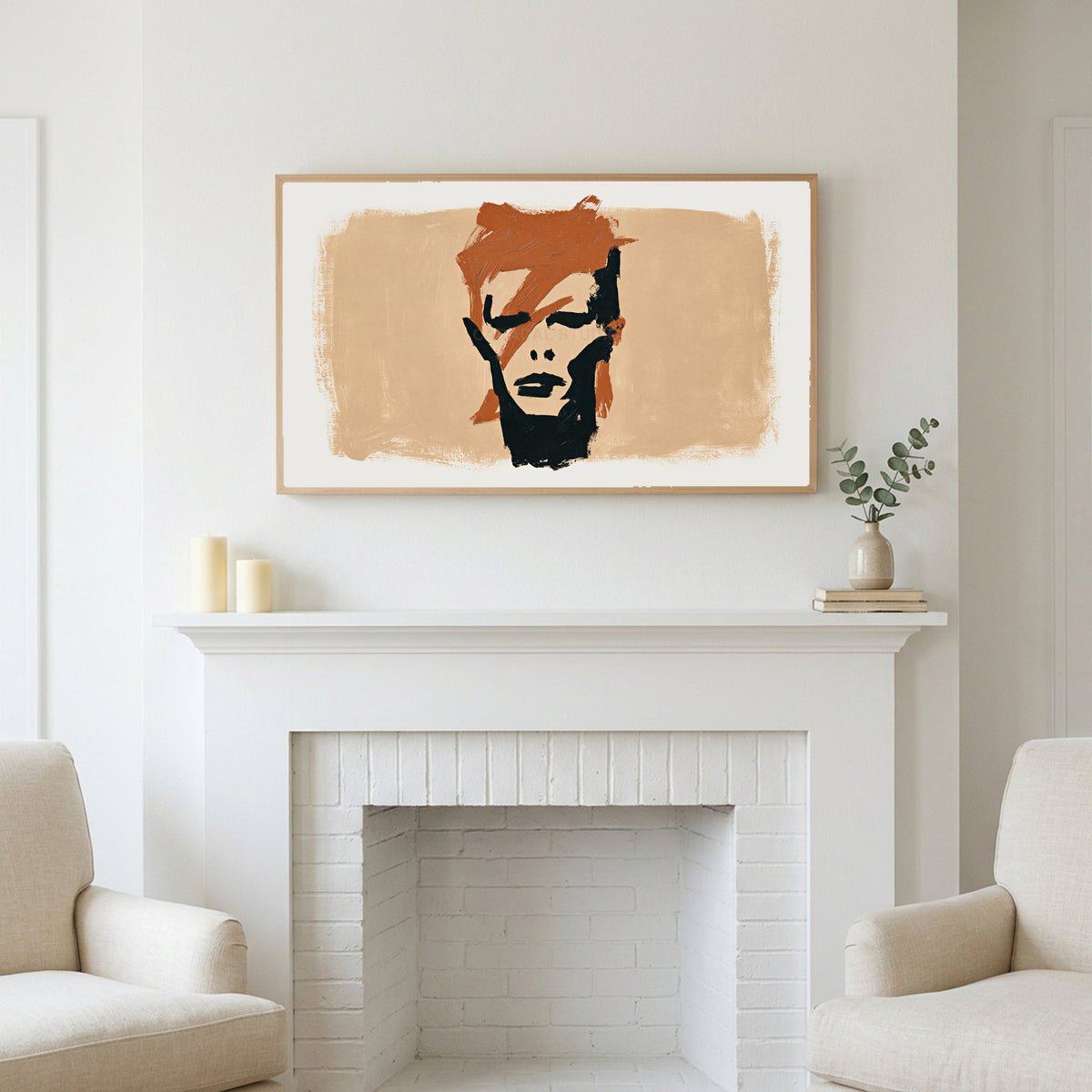 Lightning bolt portrait art above a white fireplace with candles and eucalyptus on the mantel