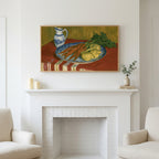 Vintage carrot still life art above a white fireplace with candles and eucalyptus on the mantel