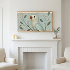 Vintage blue parrot art above a white fireplace with candles and eucalyptus on the mantel