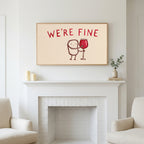 We're Fine wine doodle art above a white fireplace with candles and eucalyptus on the mantel