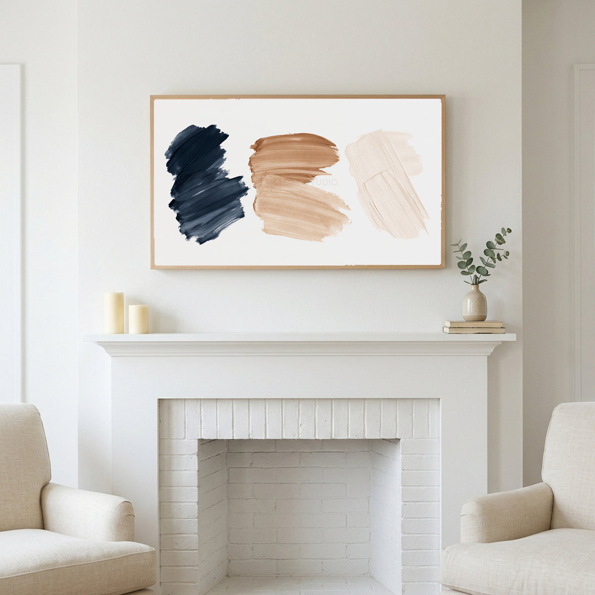 Paint stroke art above a white fireplace with candles and eucalyptus on the mantel