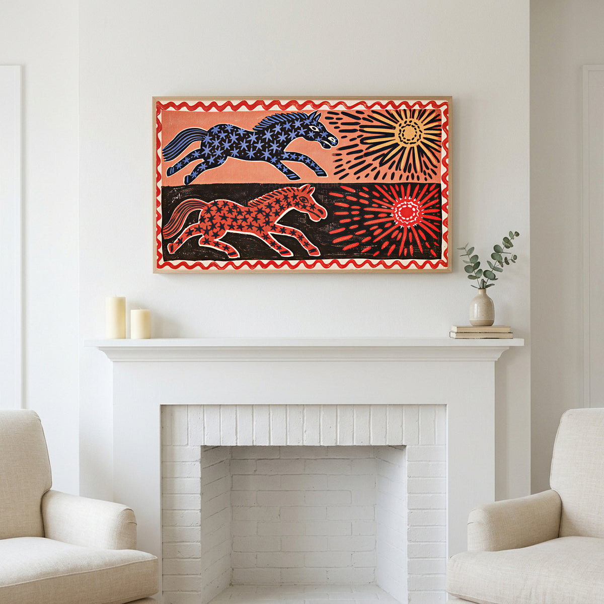 Frame TV art above a white fireplace with candles and eucalyptus on the mantel
