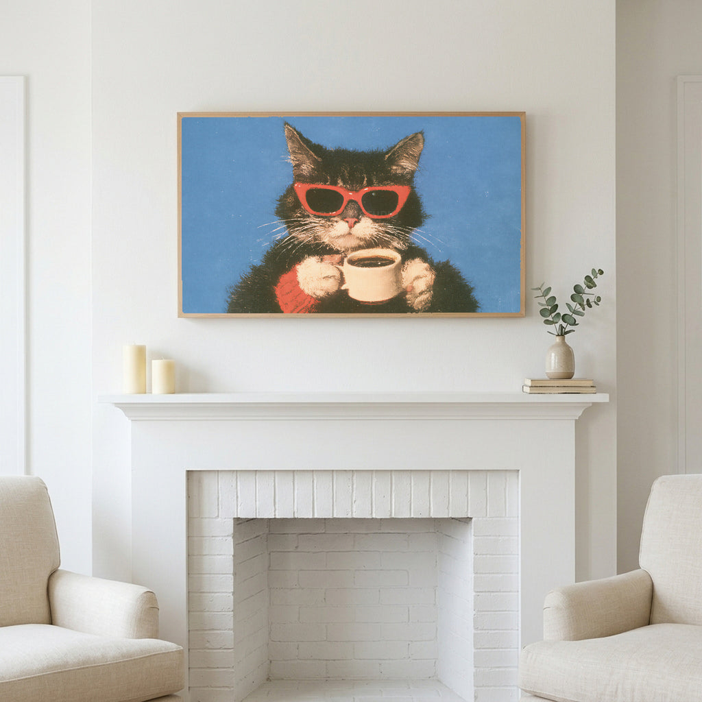 Coffee cat in sunglasses art above a white fireplace with candles and eucalyptus on the mantel