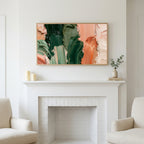 Green and copper strokes art above a white fireplace with candles and eucalyptus on the mantel