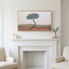 Mosaic tree art above a white fireplace with candles and eucalyptus on the mantel