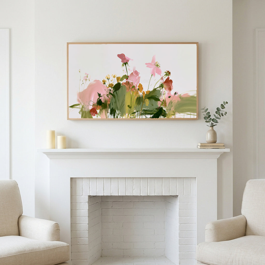 Abstract wildflowers art above a white fireplace with candles and eucalyptus on the mantel