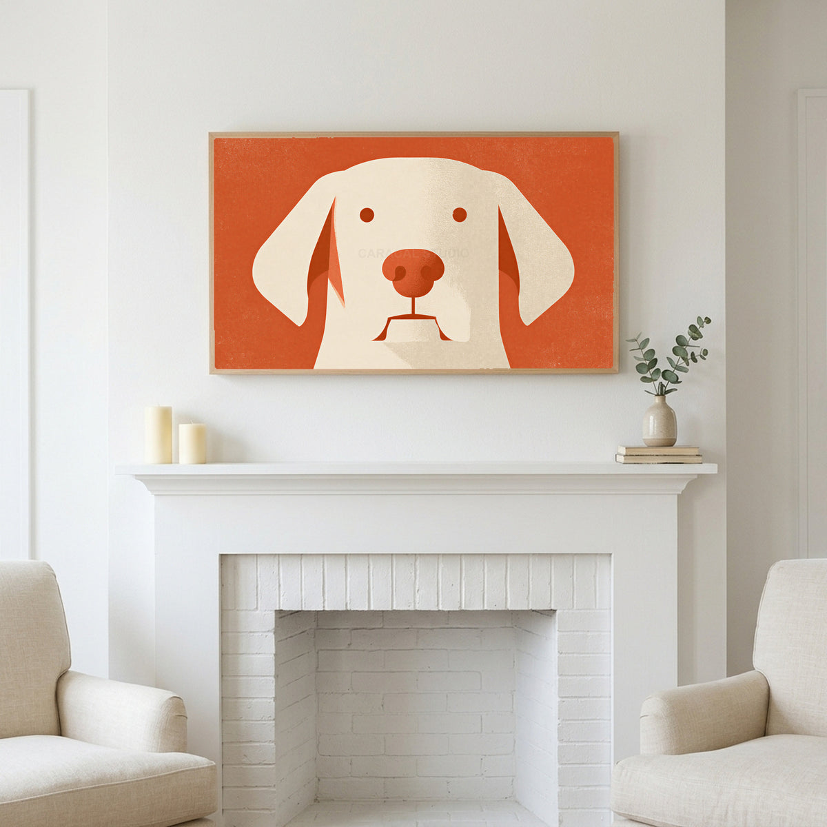 Minimalist dog art above a white fireplace with candles and eucalyptus on the mantel