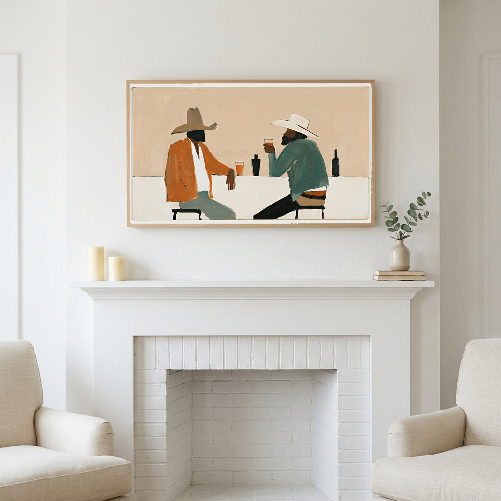 Cowboys and saloon drinks art above a white fireplace with candles and eucalyptus on the mantel