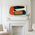 Abstract organic shapes art above a white fireplace with candles and eucalyptus on the mantel