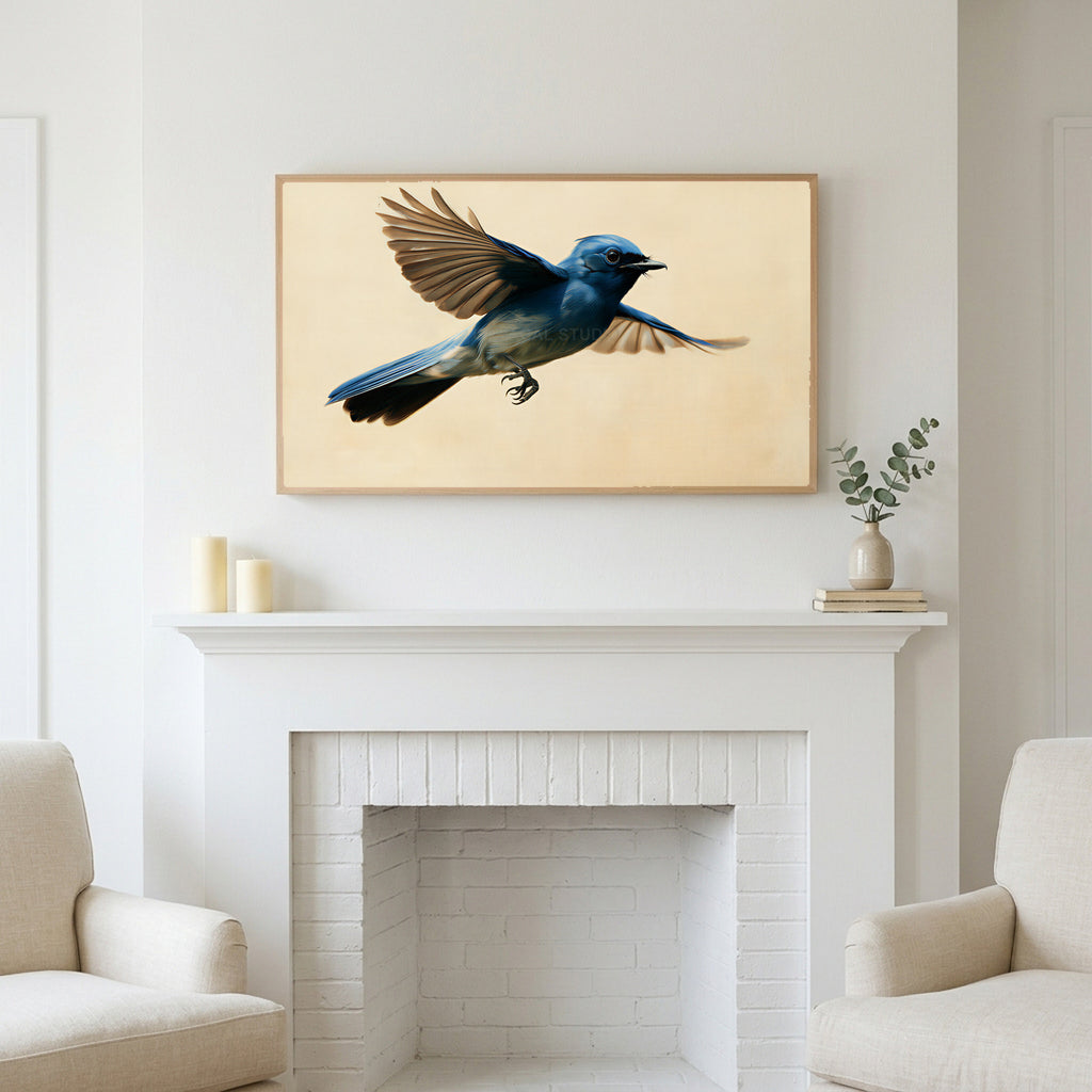 Blue flycatcher art above a white fireplace with candles and eucalyptus on the mantel