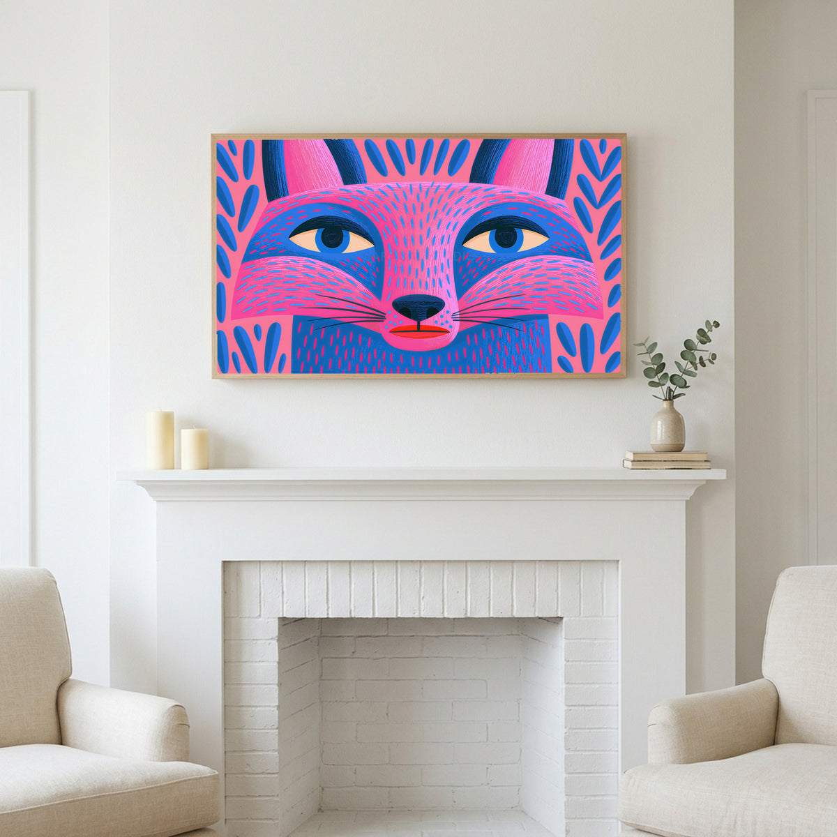 Frame TV art above a white fireplace with candles and eucalyptus on the mantel