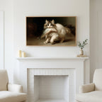 Kitten with a big fish art above a white fireplace with candles and eucalyptus on the mantel