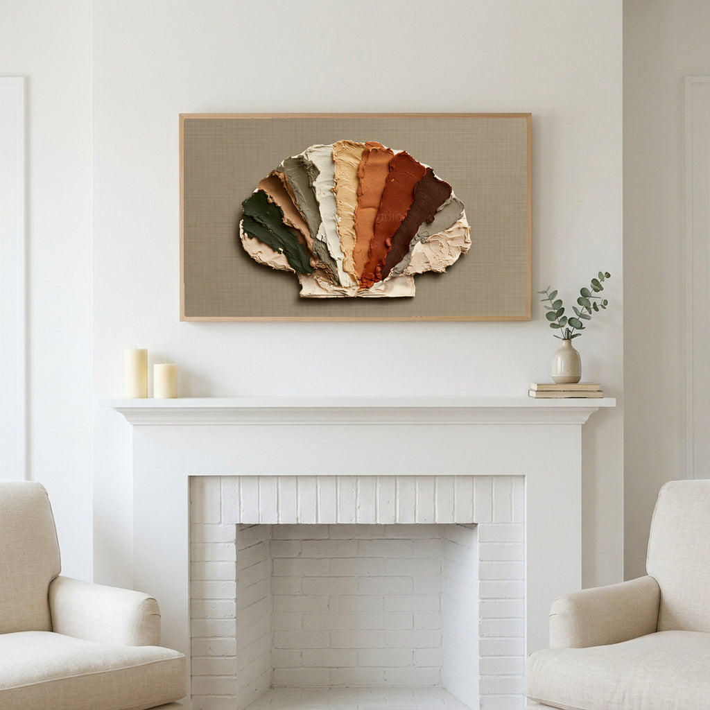 Earthy impasto seashell art above a white fireplace with candles and eucalyptus on the mantel