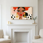 Frame TV art above a white fireplace with candles and eucalyptus on the mantel