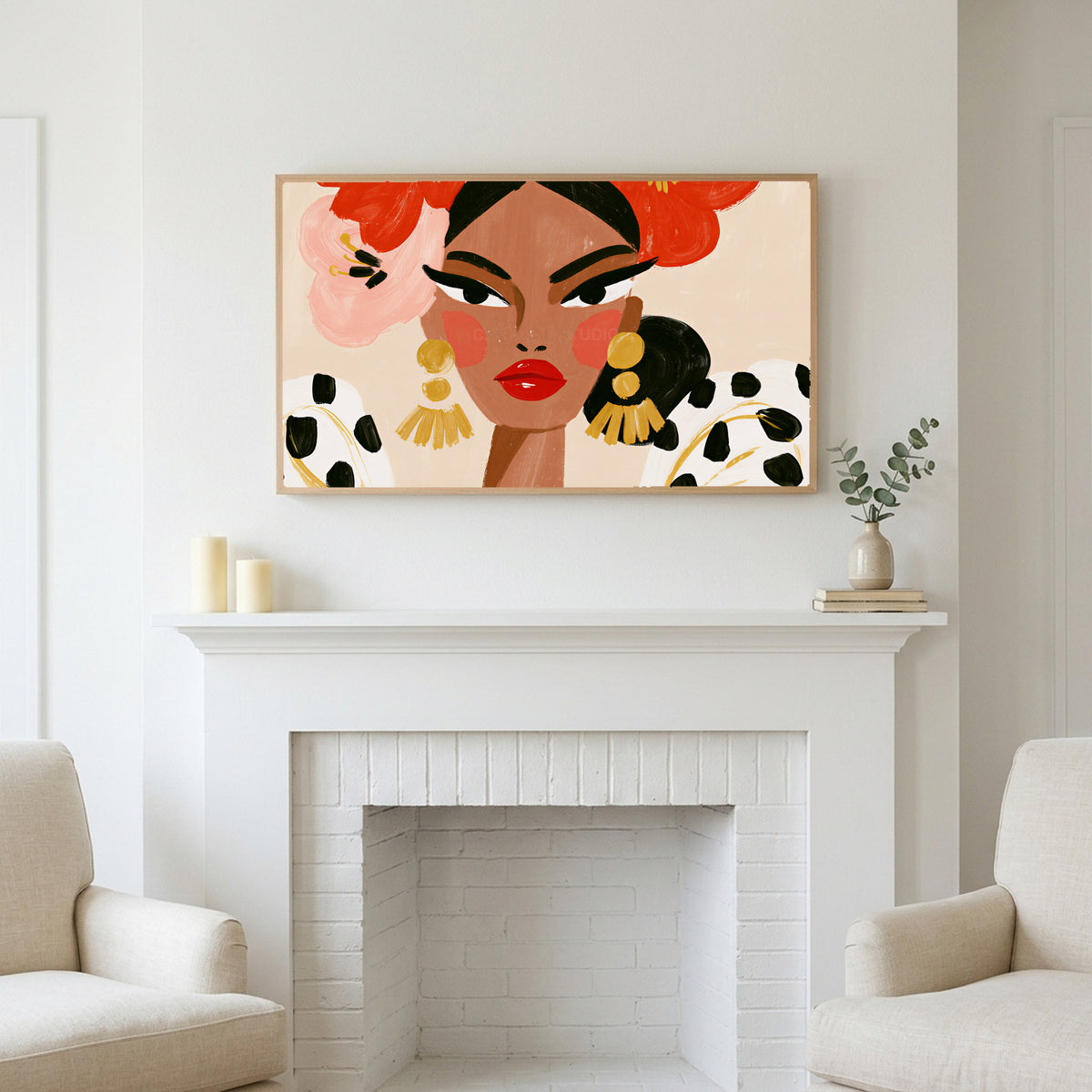 Frame TV art above a white fireplace with candles and eucalyptus on the mantel