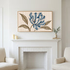 Striped tulip art above a white fireplace with candles and eucalyptus on the mantel