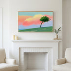 Frame TV art above a white fireplace with candles and eucalyptus on the mantel