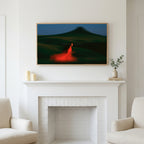 Frame TV art above a white fireplace with candles and eucalyptus on the mantel