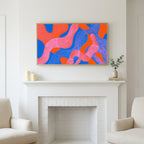Wavy abstract shapes art above a white fireplace with candles and eucalyptus on the mantel